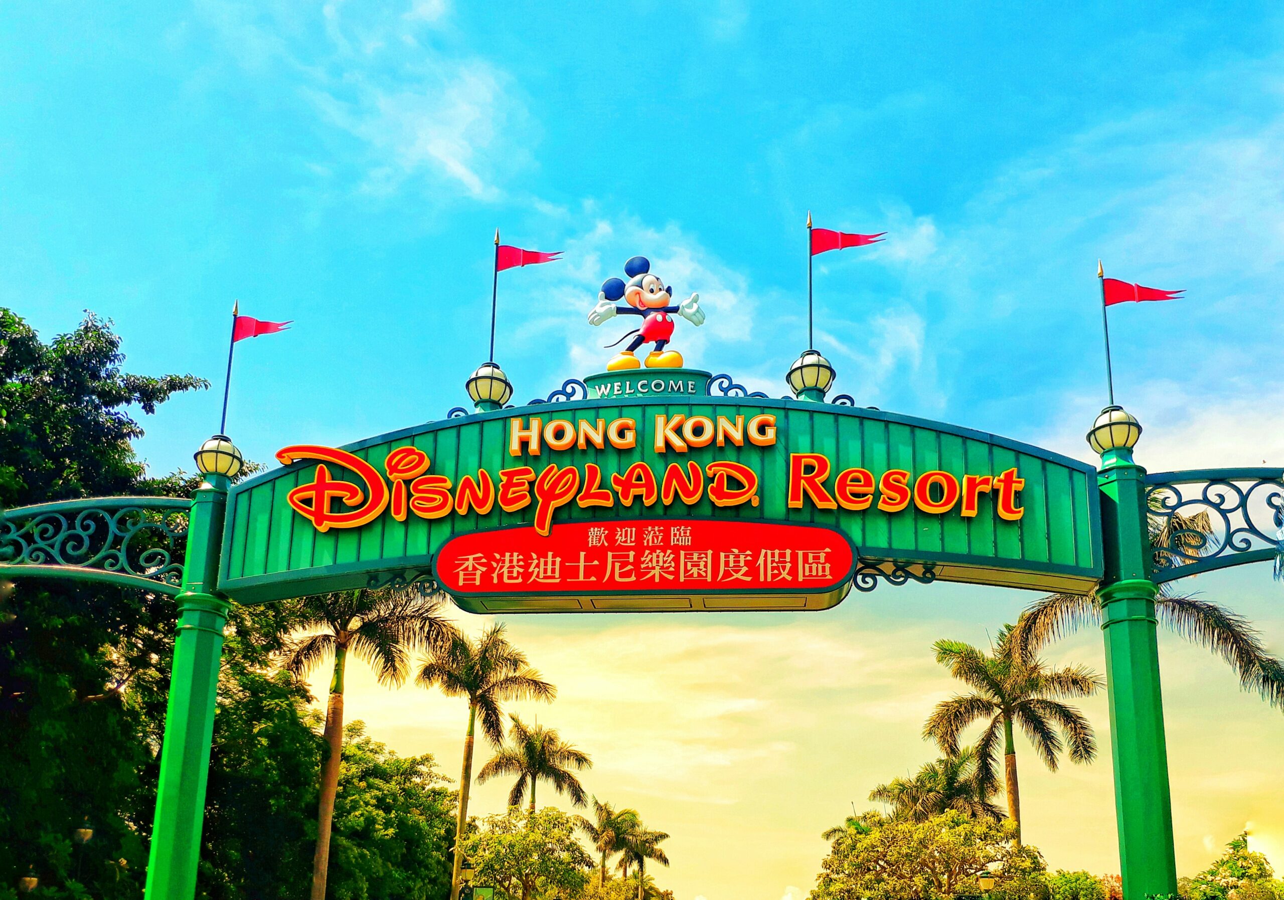 Mickey mouse on top of a sign