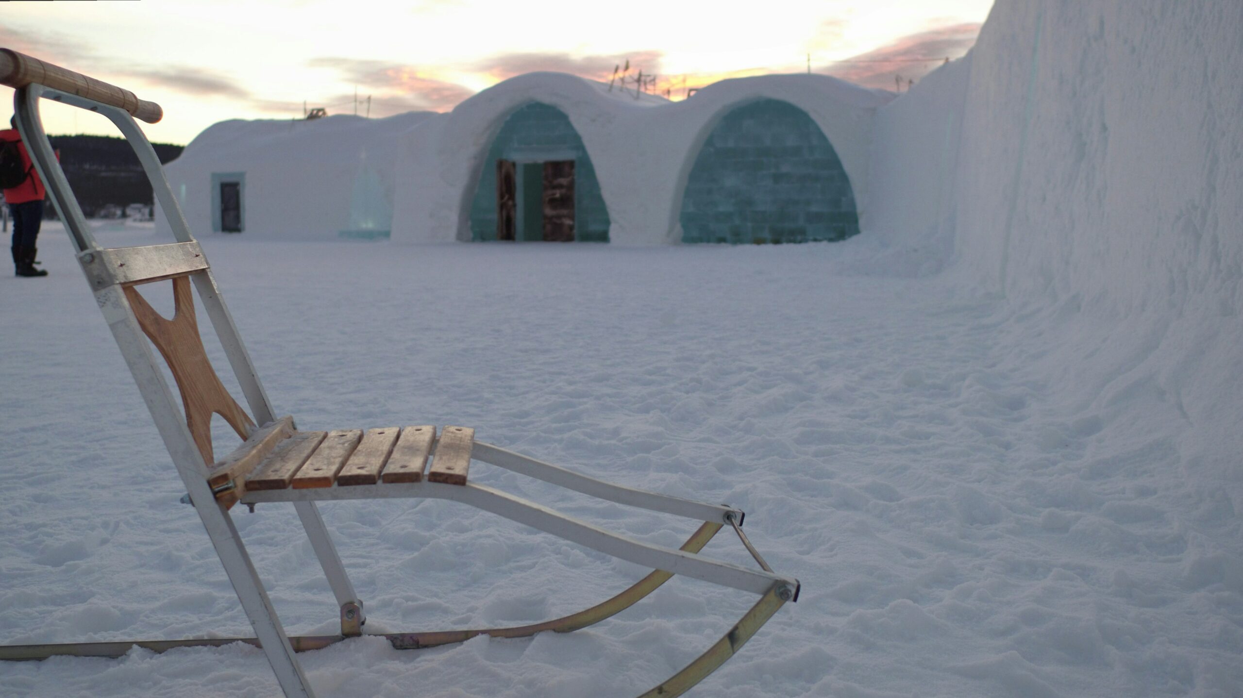 a swedish spark in front of an ice hotel