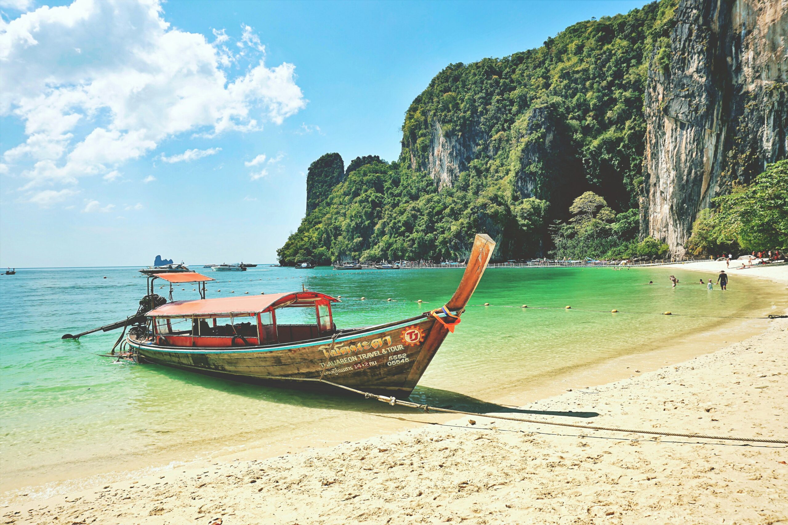 a wooden boat stranded on a beach