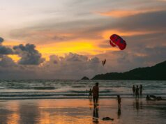 Exploring the Beaches of Phuket paragliding over a sandy beach