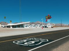 Driving from New York to Los Angeles on Route 66: The Ultimate Road Trip an empty road with a diner next to it