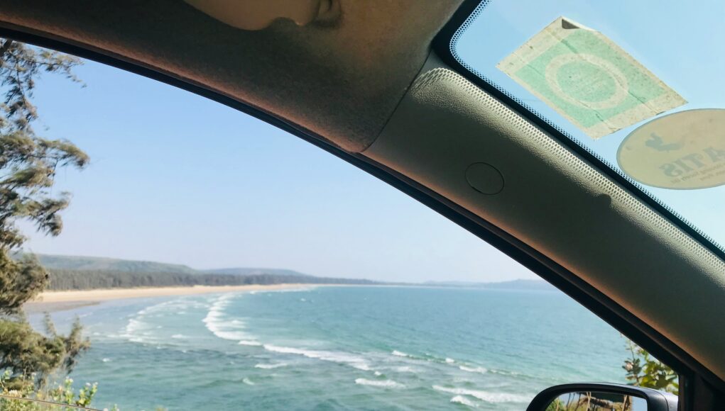 looking out the car window over the coast