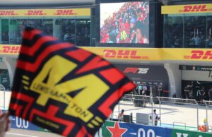 How Much Would It Cost to Attend Every Formula 1 Race? flags at race track