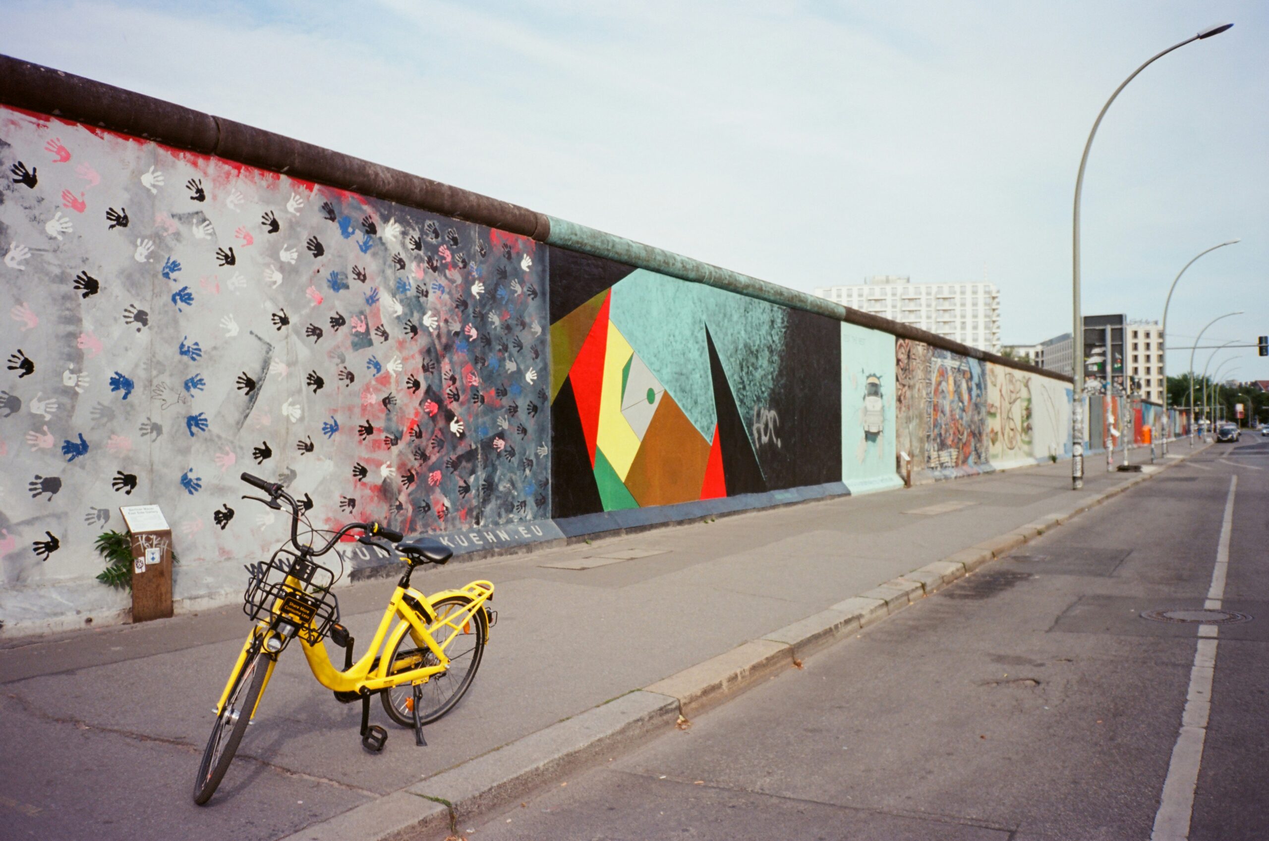 a wall full of graffiti 