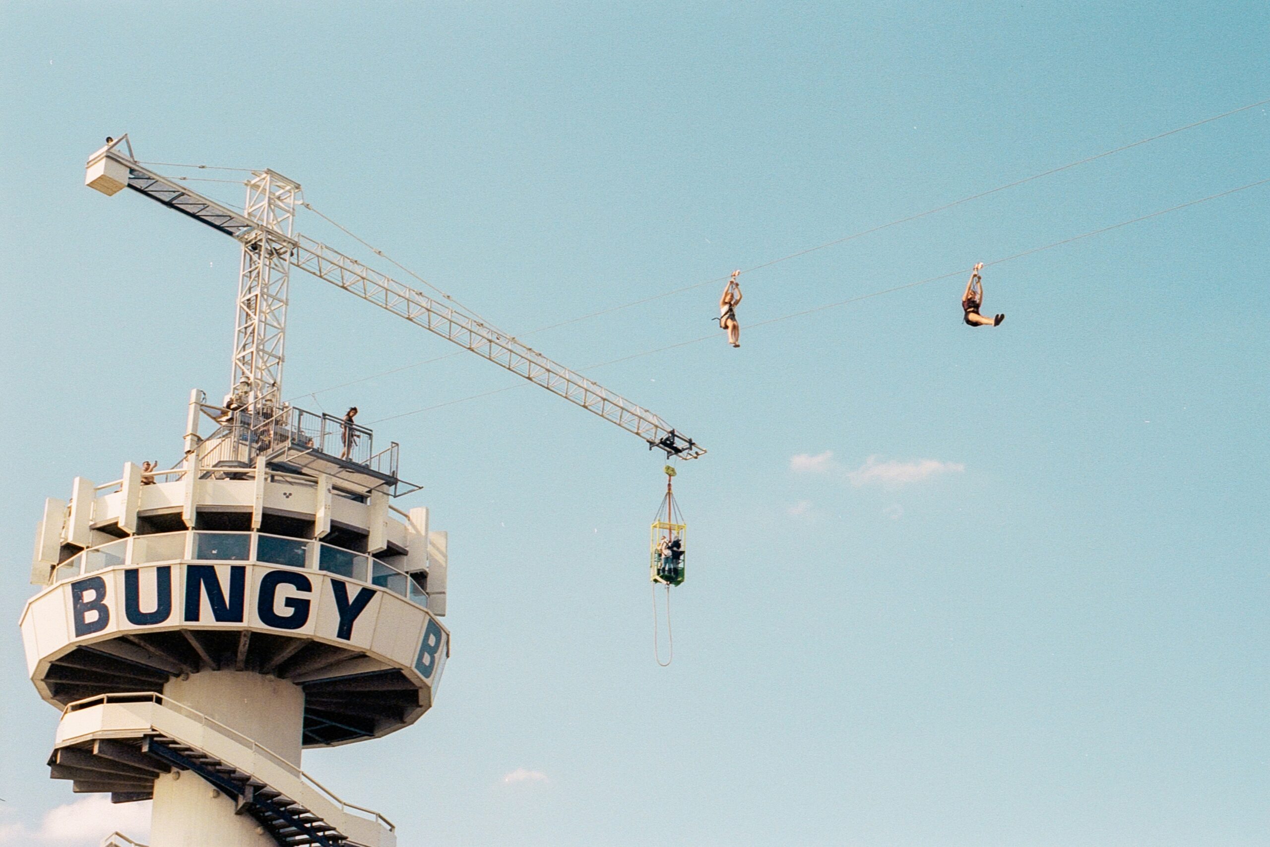 a crane on top of a tall building