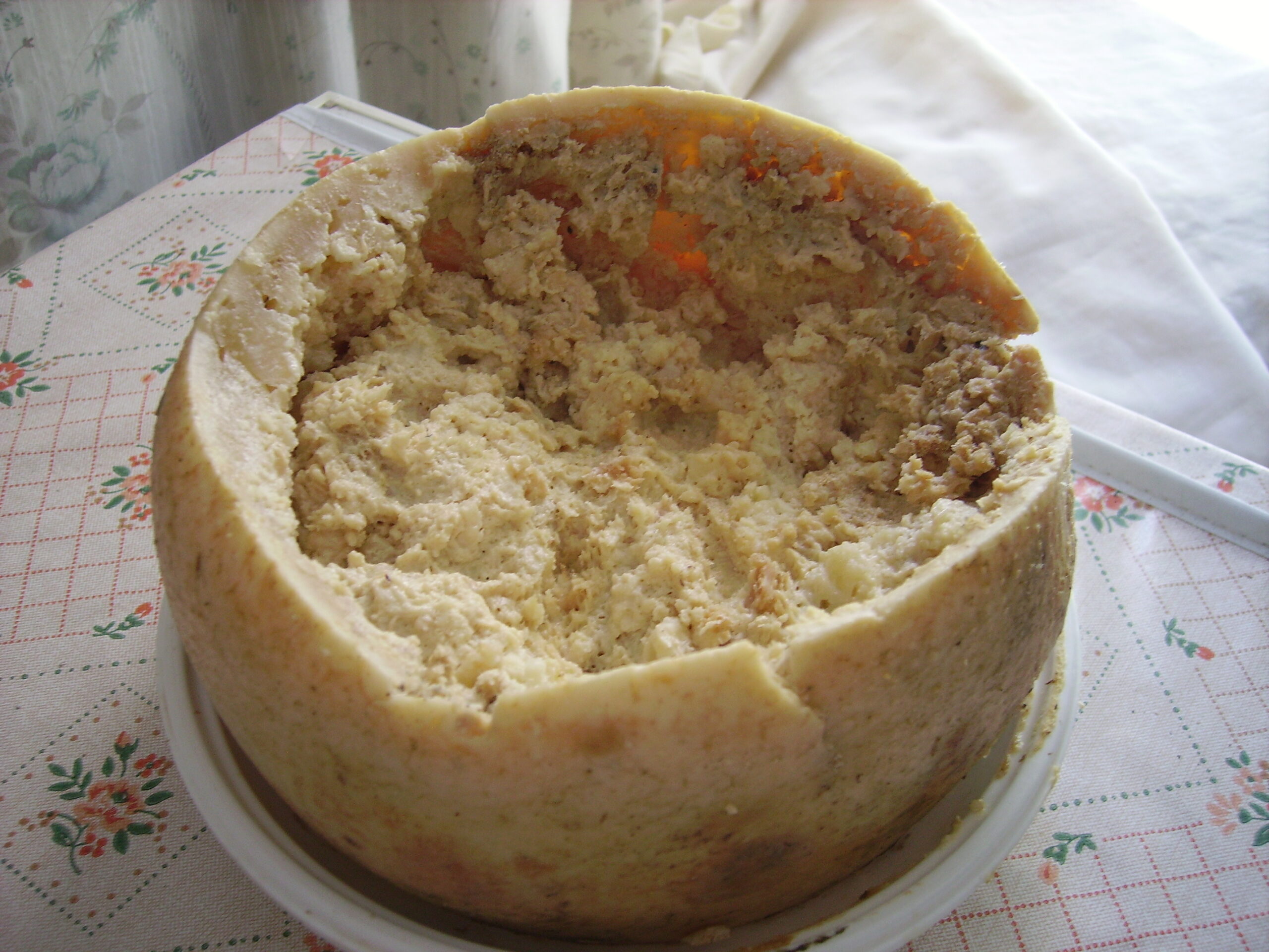 a white cheese with maggots inside