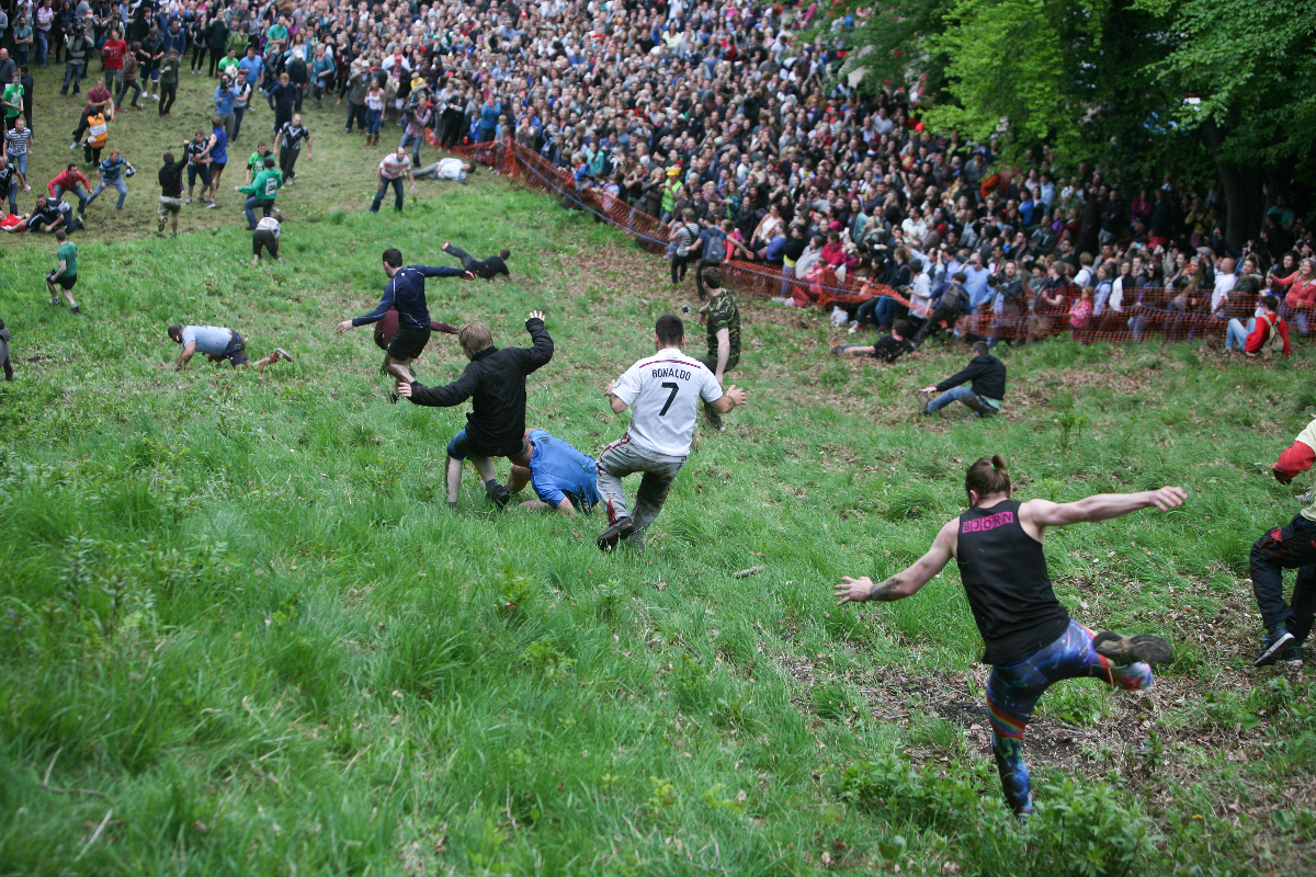 people running down a hill