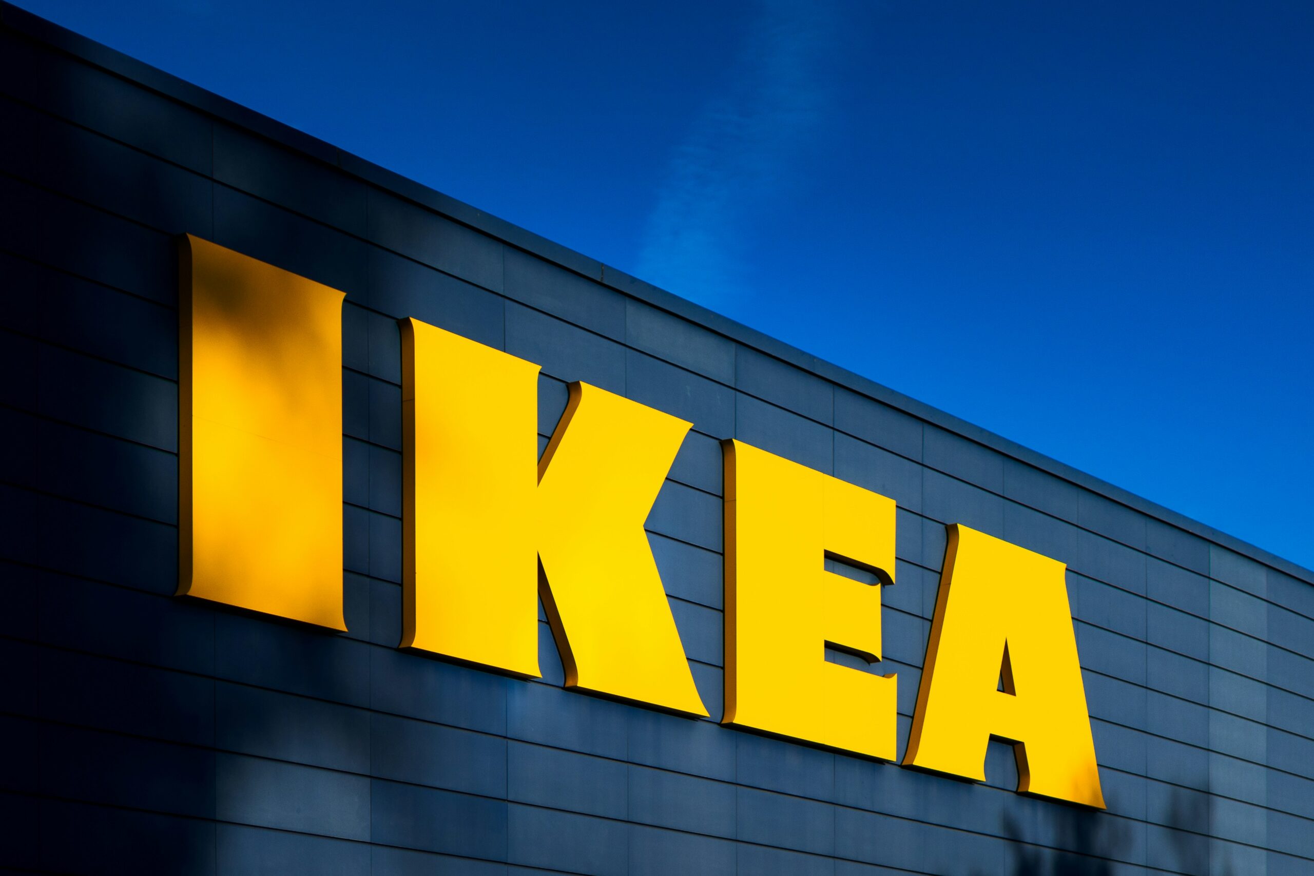 a blue building with a yellow sign