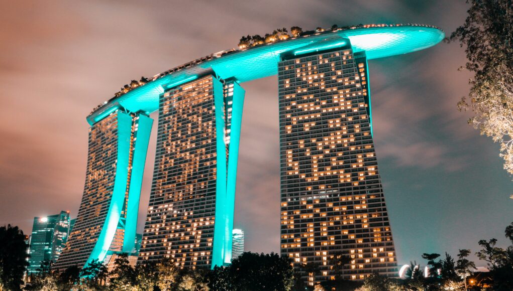 Marina Bay Sands a big hotel in green neon lights