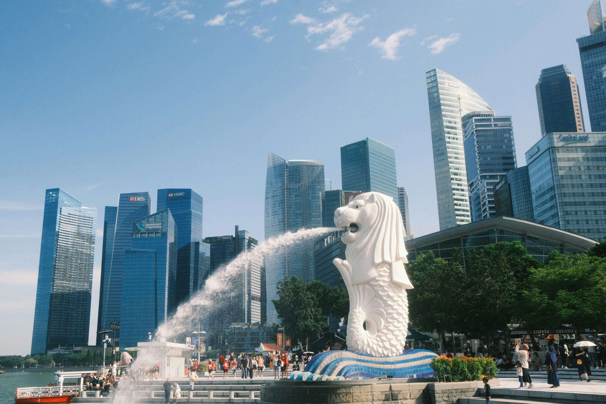 a white fountain lion spraying water from its mouth