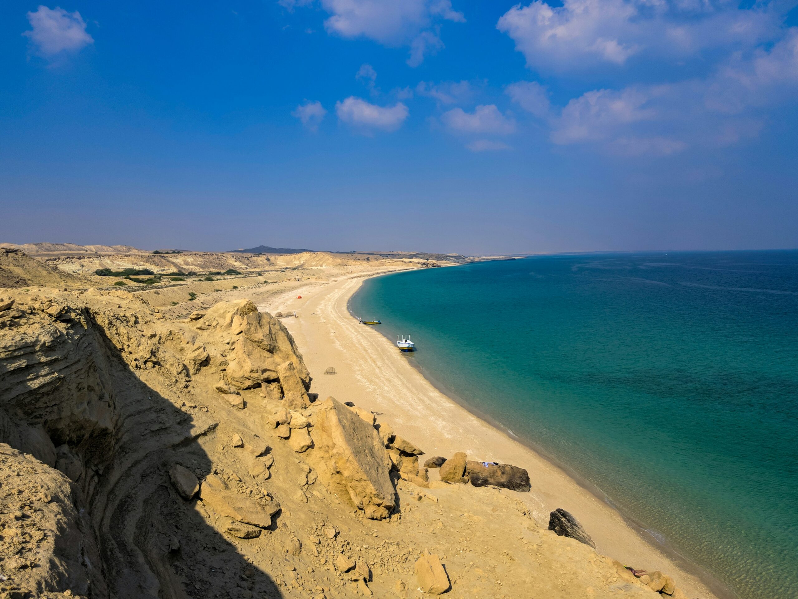 a massive sandy beach going into crystal clear waters