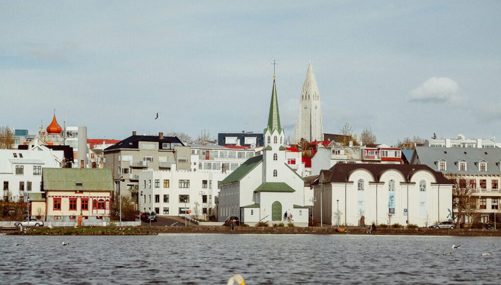 Reykjavík a swan swim pass a church