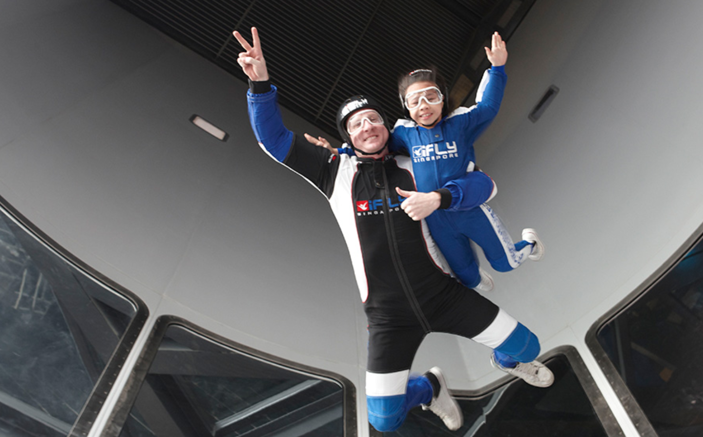 a man and a kid flying