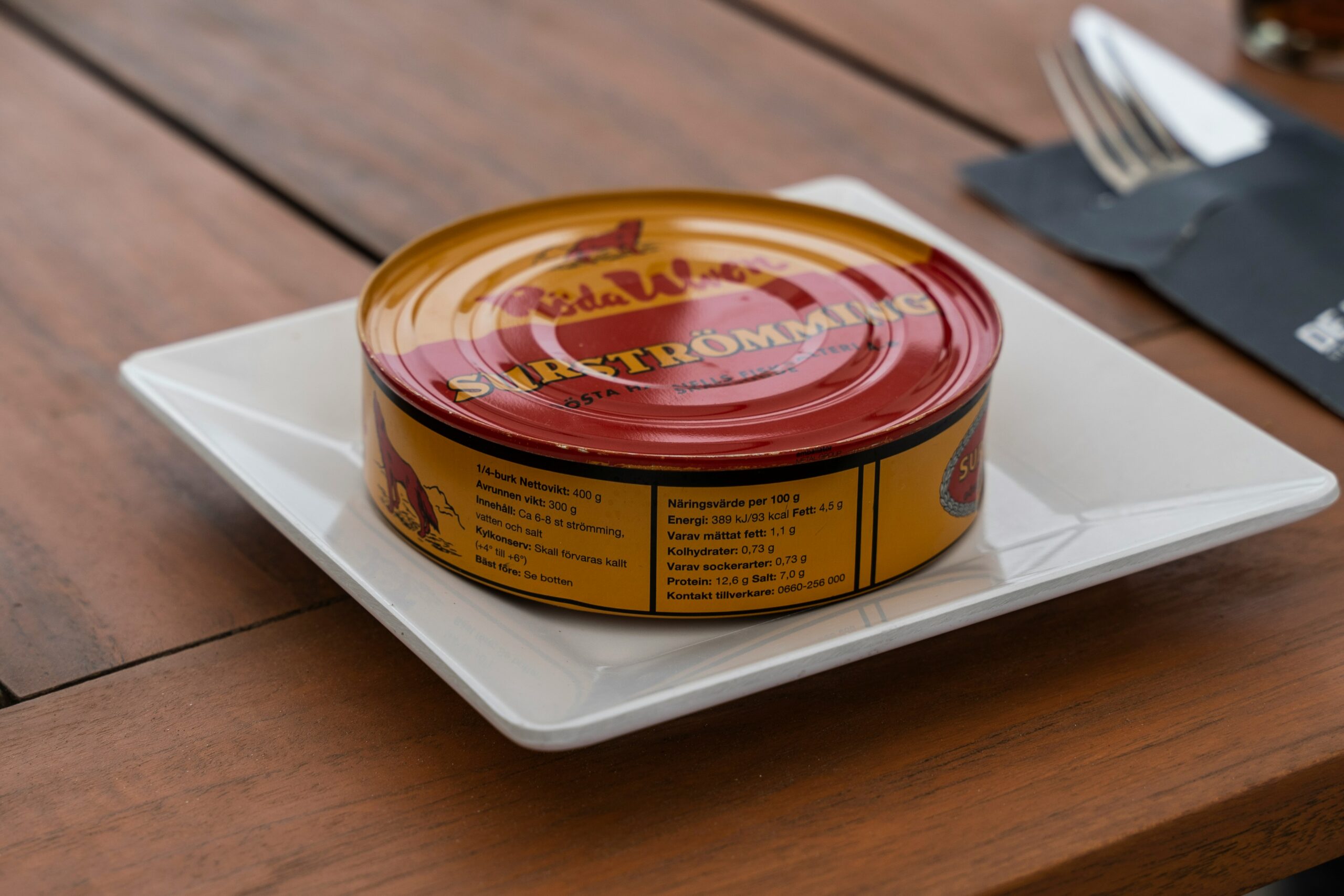 a yellow and red tin 