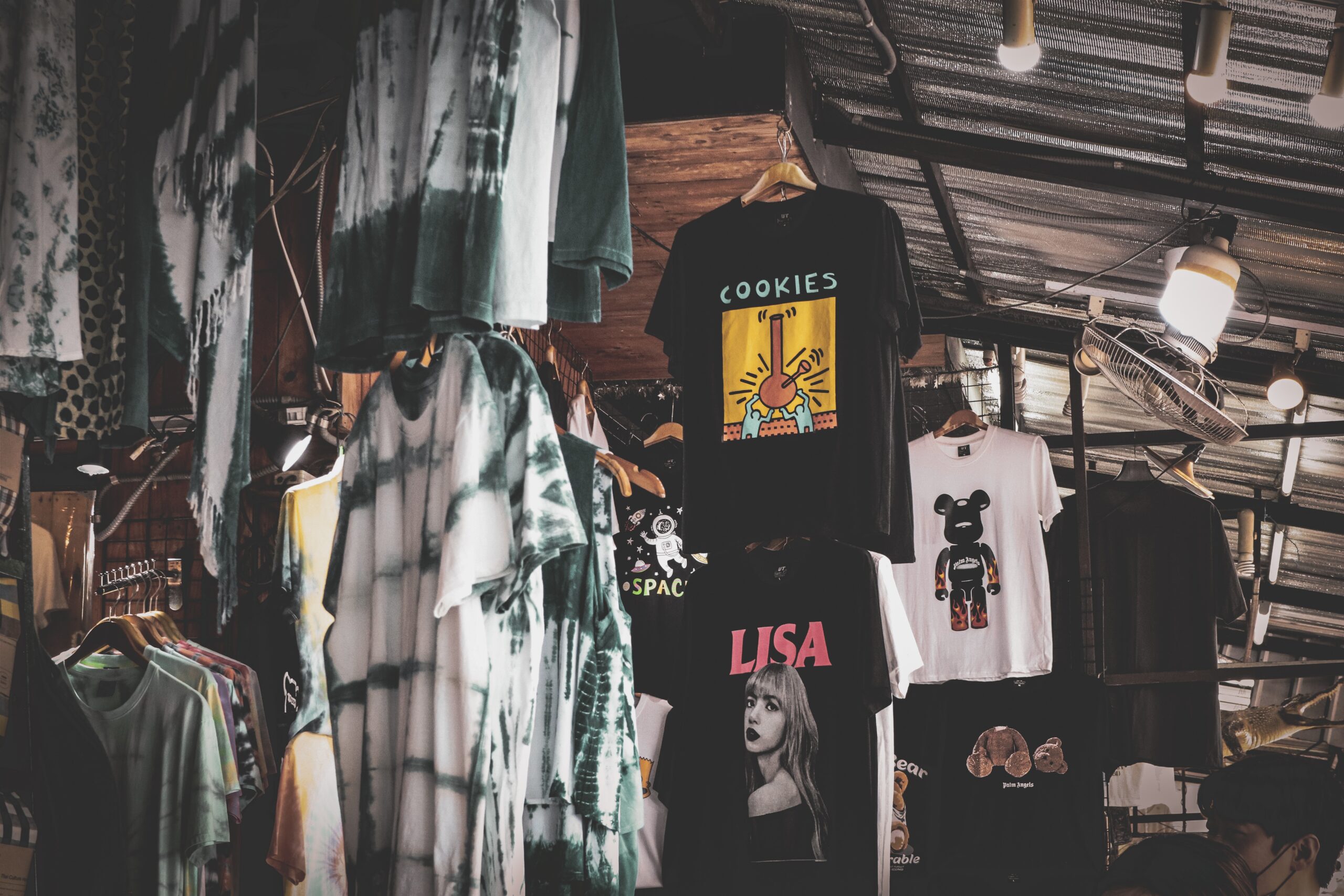 a lot of t-shirts hanging