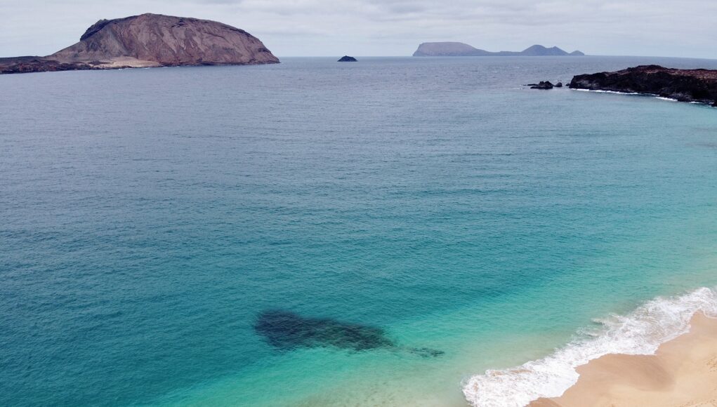 crystal clear water and a sandy beach
