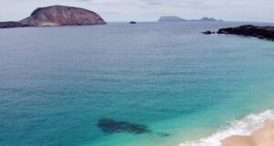 Where to Find the Sun in Europe This Winter: 6 Warm Escapes for Cold Days crystal clear water and a sandy beach