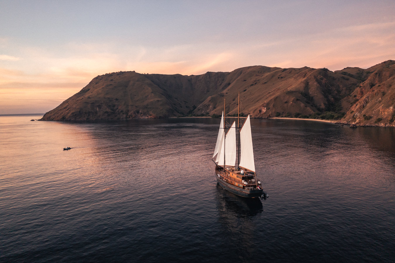 a sailboat on calm waters