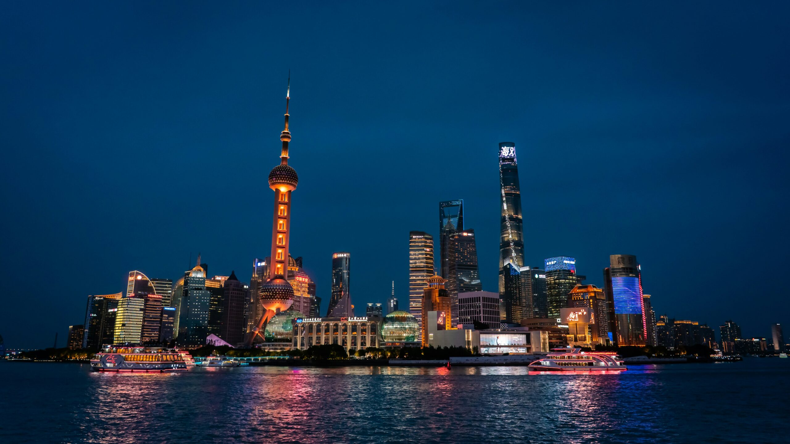 A mega city by the water at night