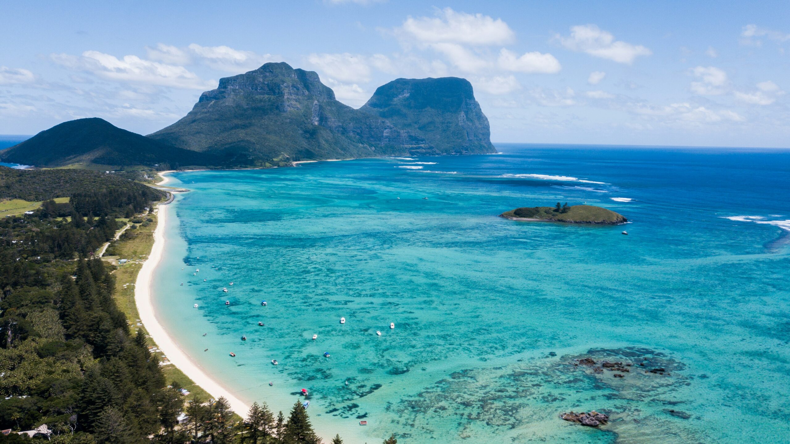 crystal clear water with a mountain as a backdrop 