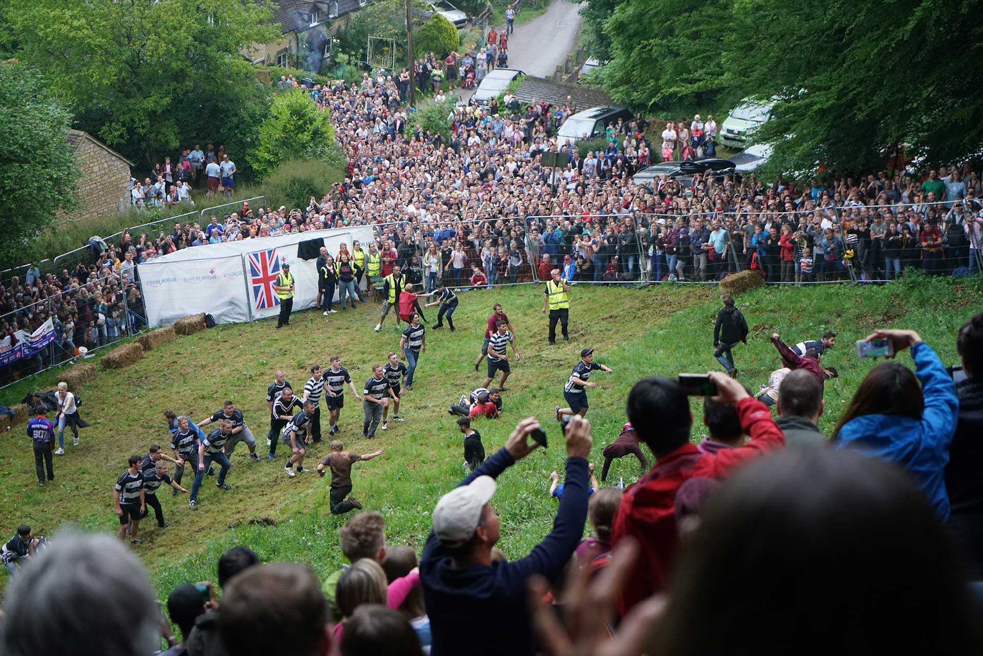 a bunch of guys running down a hill