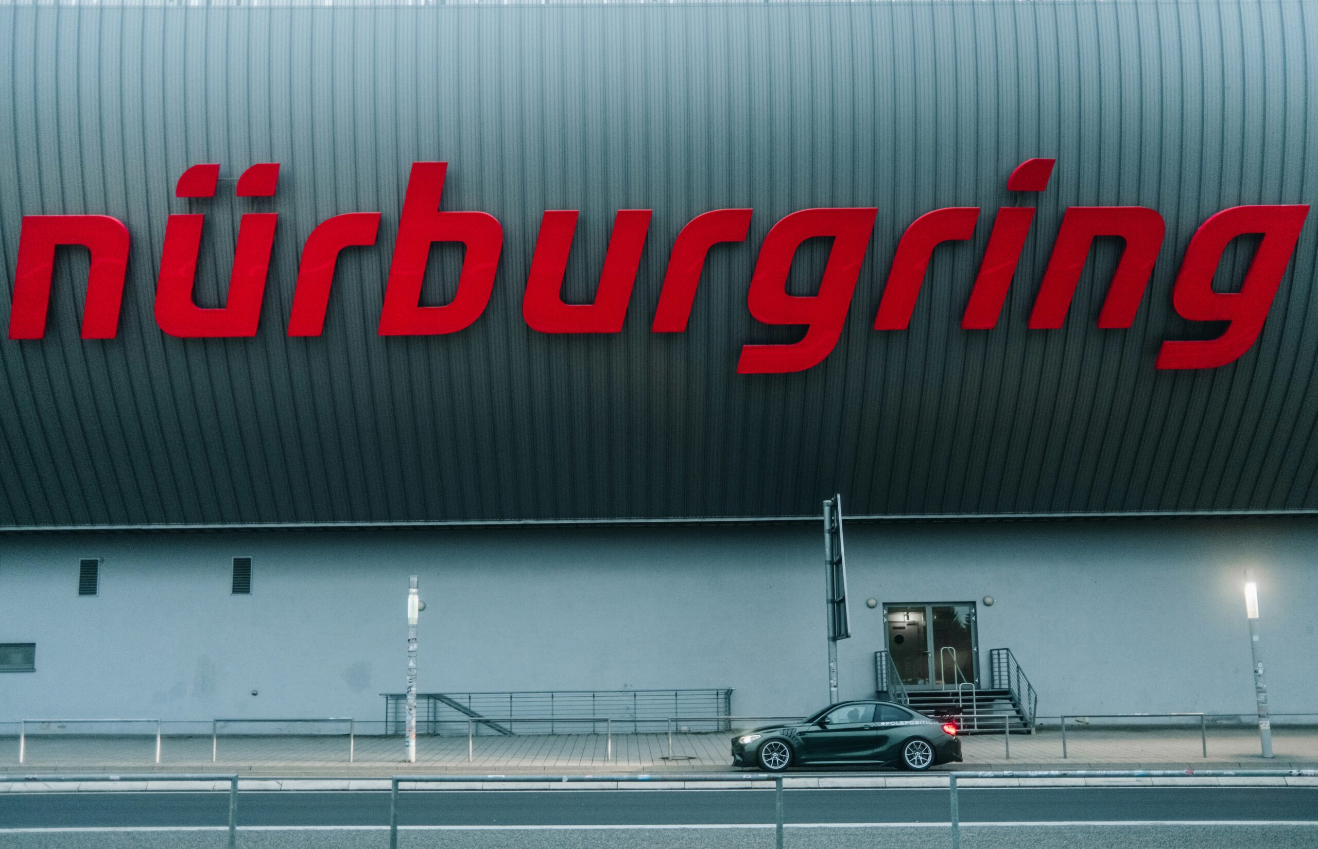 big red sign on a factory wall