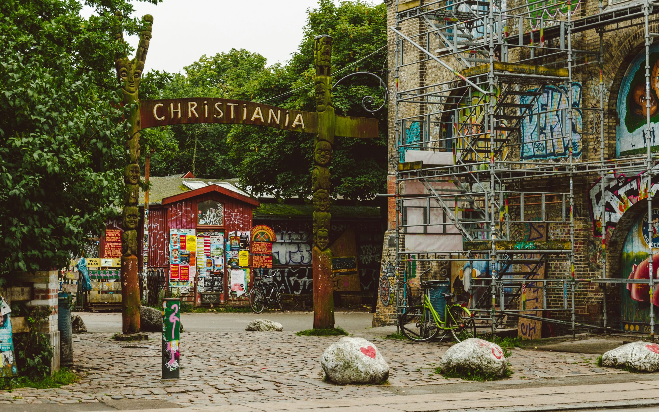 a house with lots of graffiti and a big sign