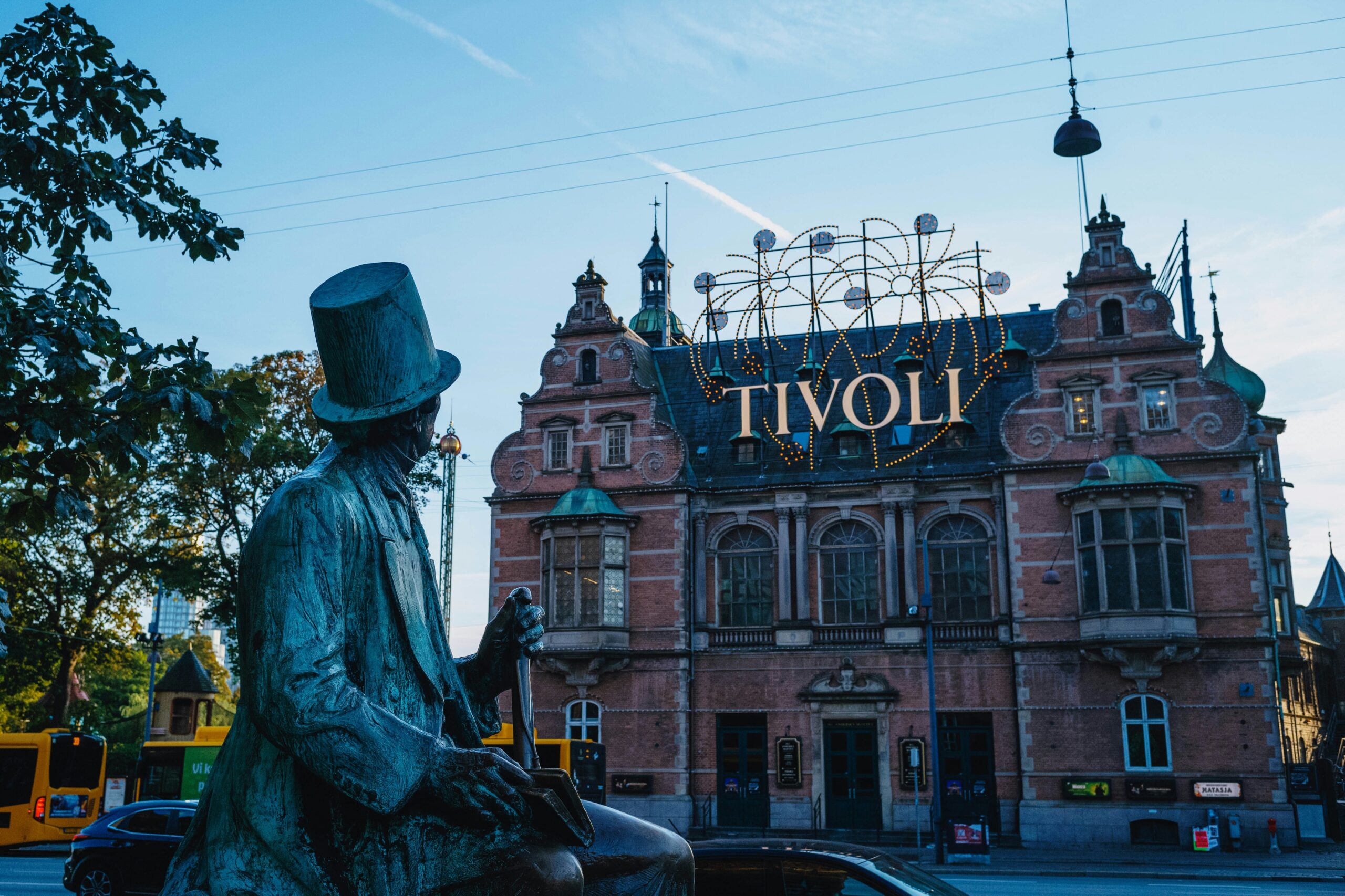 a statue in front of a brick building