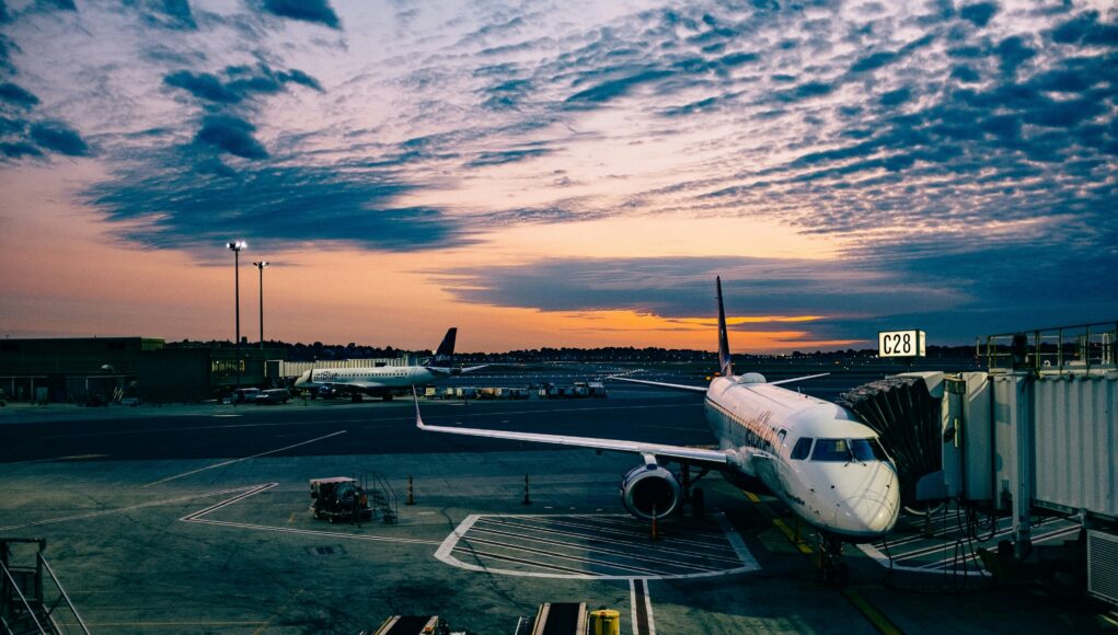 Airport airplane on tarmac in the sunset