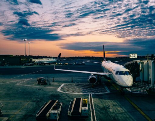 The Five Gateways to the Capital: A Comprehensive Guide to London’s Major Airports airplane on tarmac in the sunset