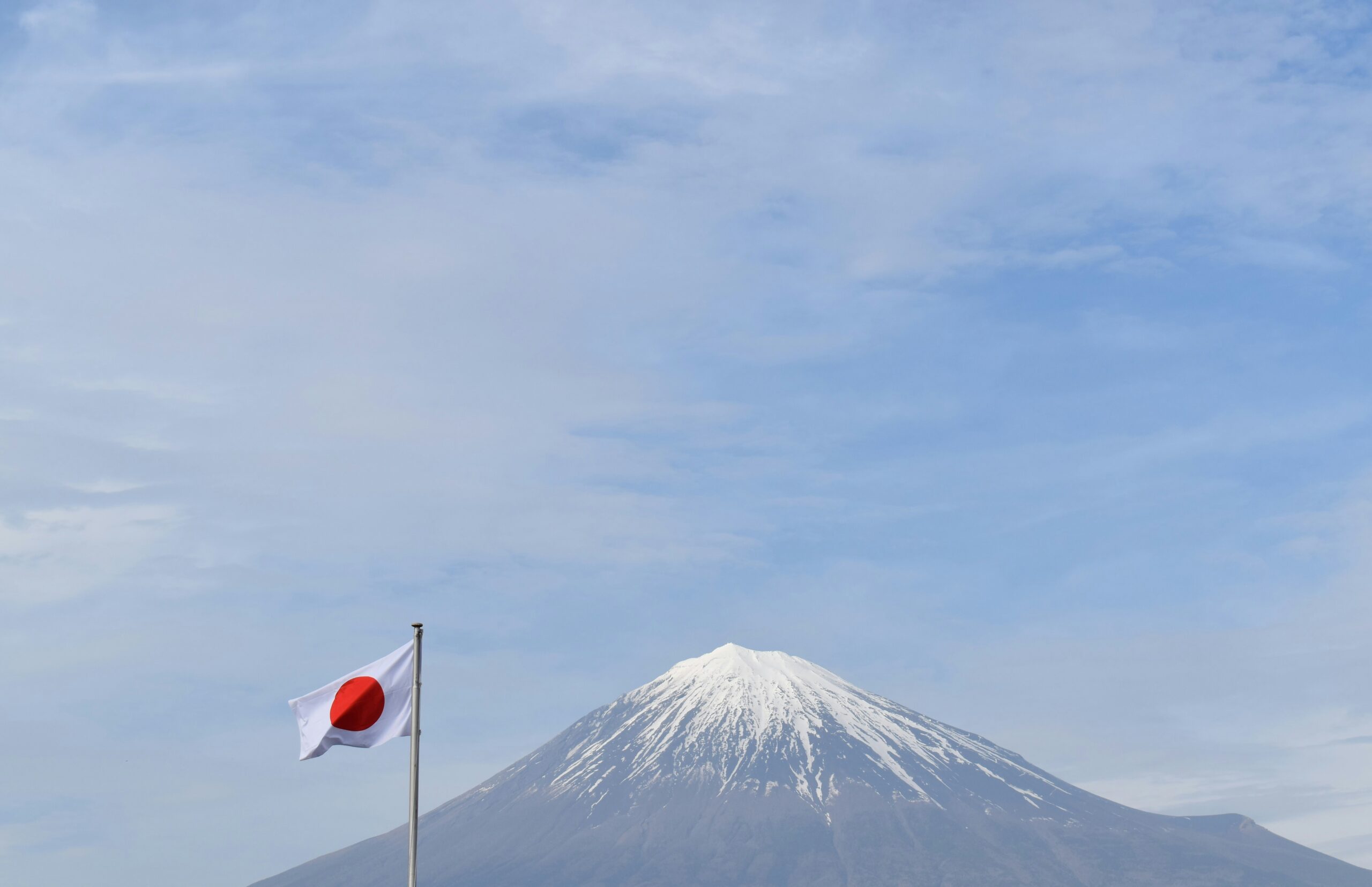 a flag in front of a mountain