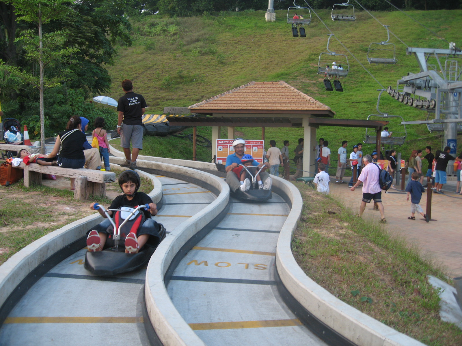 two go karts racing downhill  